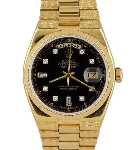 gold rolex day date black face